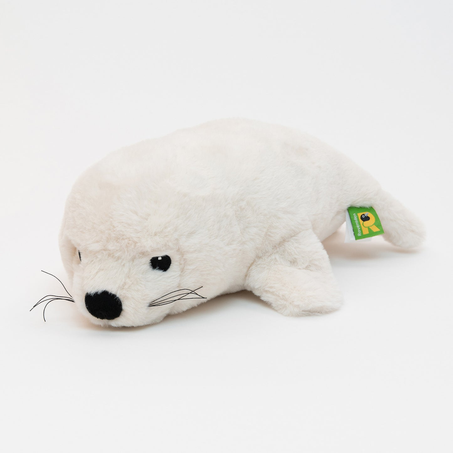 A white plush seal soft toy on a white background.