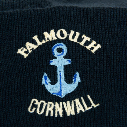 Close up of embroidered detail Falmouth, Cornwall embroidered in white around an anchor embroidered in blue