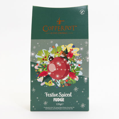 A pack of festive spiced fudge pictured on a white background. The pack is dark green with a red bauble illustration at the centre, surrounded by festive imagery.