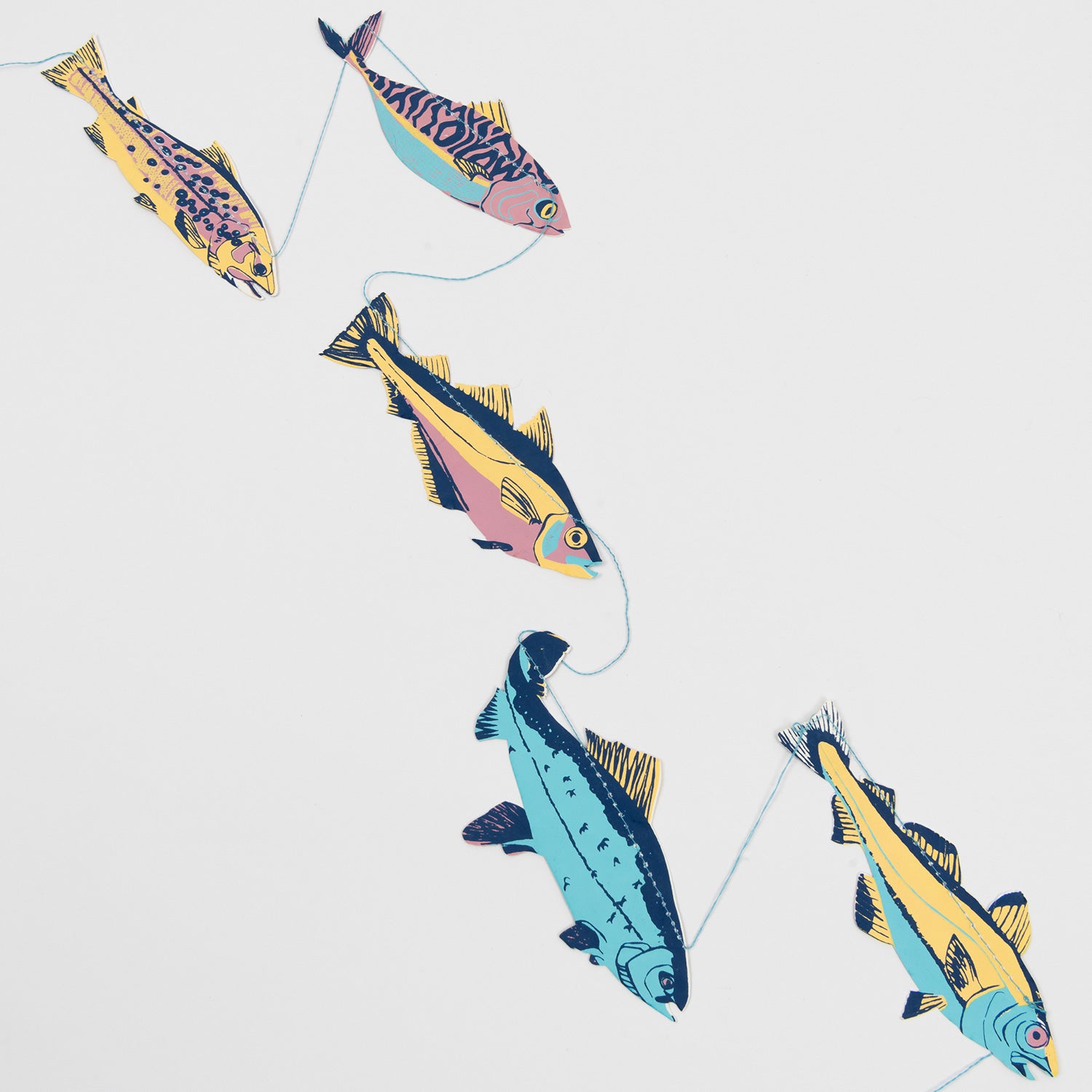 A close-up photo of five of the fish on the fish garland.