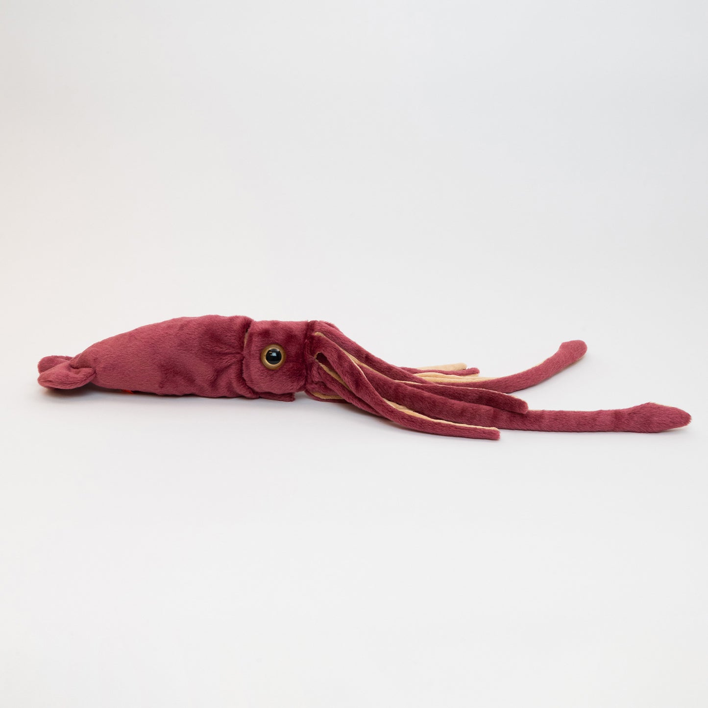 A red plush squid pictured on a white background.