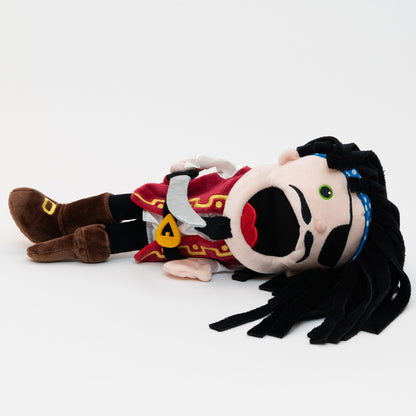 Pirate Hand Puppet. The adorable details of this fun fabric character include fabulous black floppy hair, a silver pirate sword, and a moving mouth with toune. Complete with black eyepatch, mustache & goatee, Red and gold detailed vest and belt, a white shirt and brown boots.