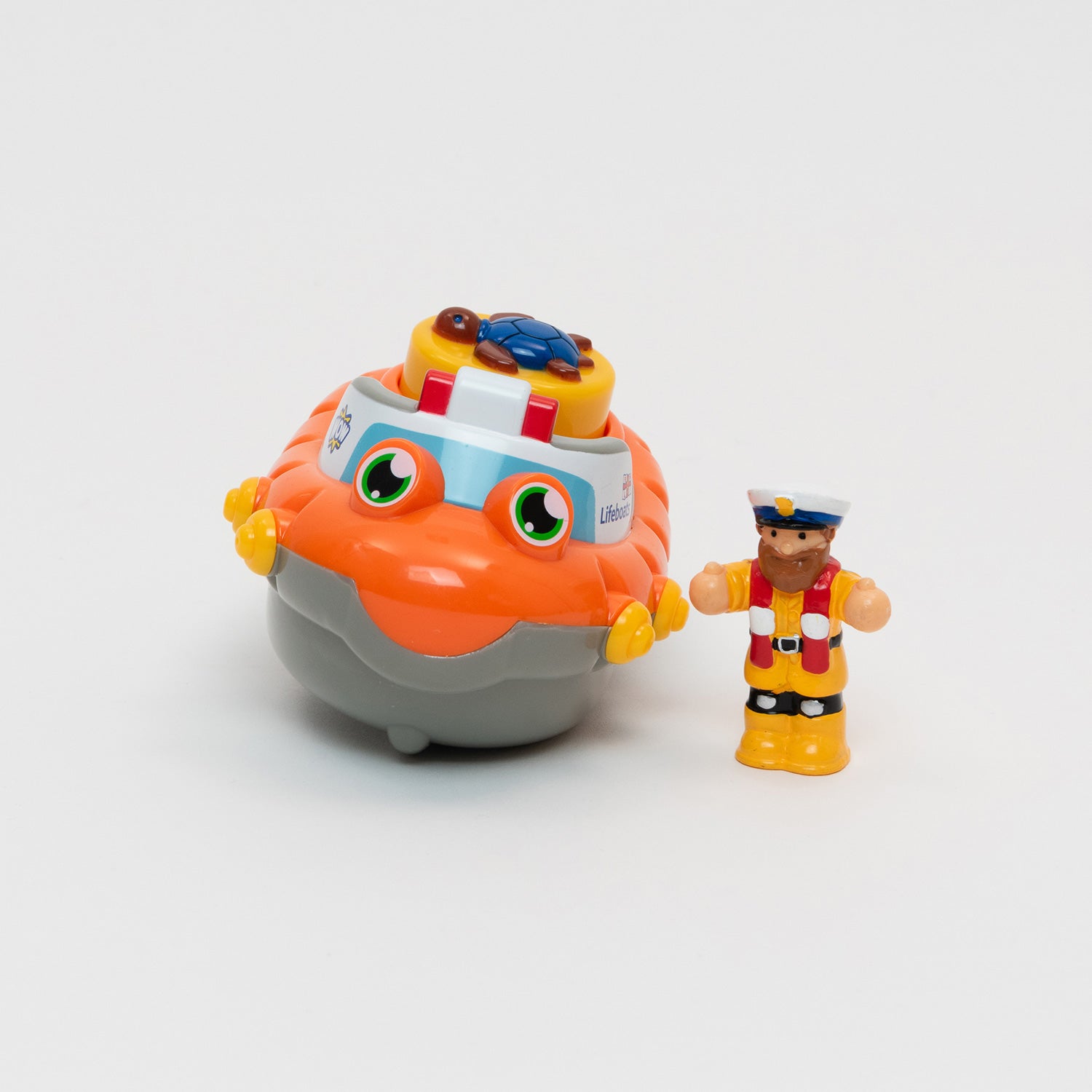 An RNLI lifeboat bath toy with mini lifeboat man figurine. 