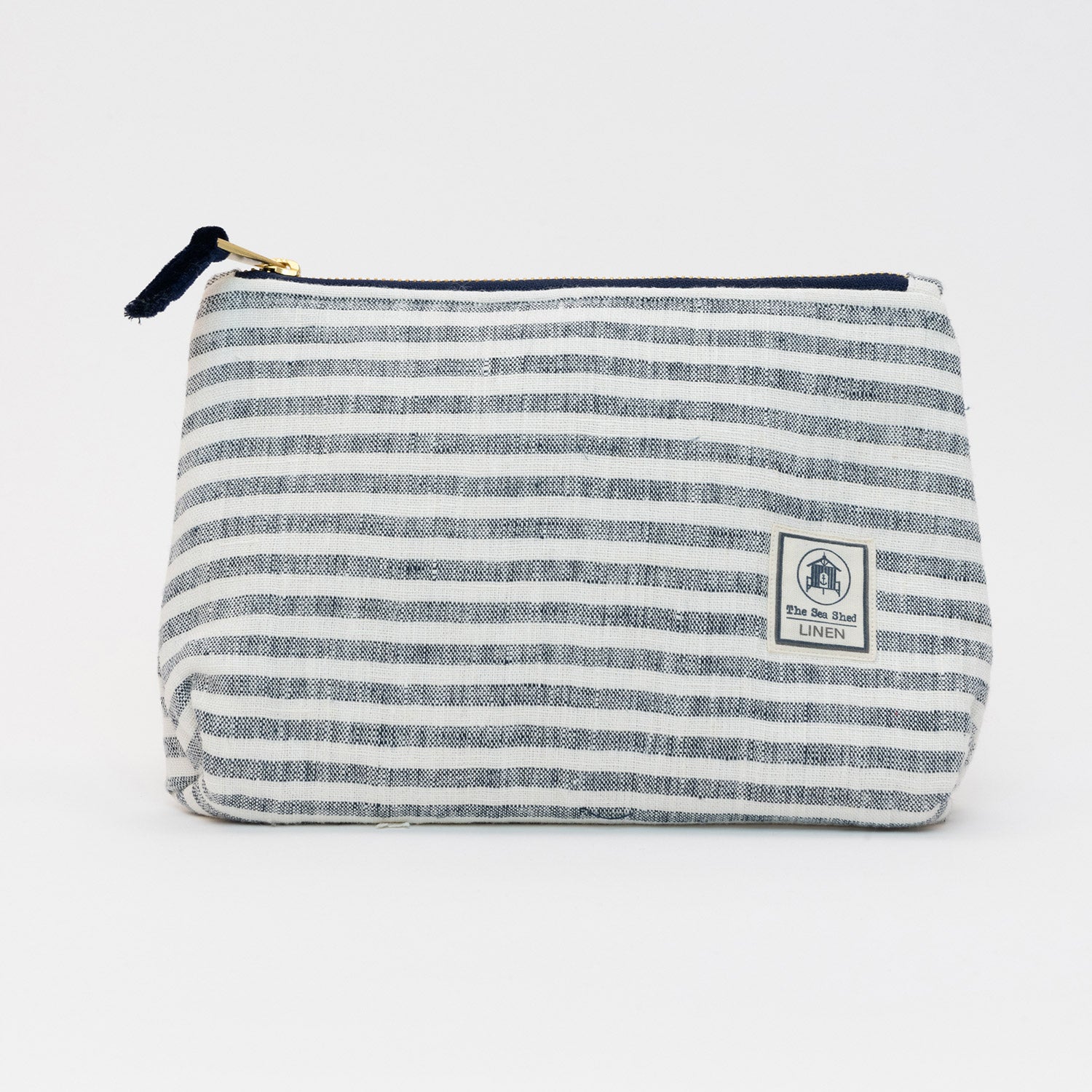 A photo of the large linen cosmetic bag on a white background. It has white and blue stripes.