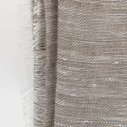 A close-up photo of the sand linen scarf on a white background.