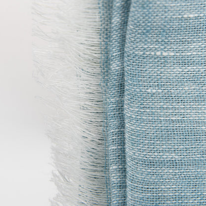 A close-up photo of the sea blue linen scarf.