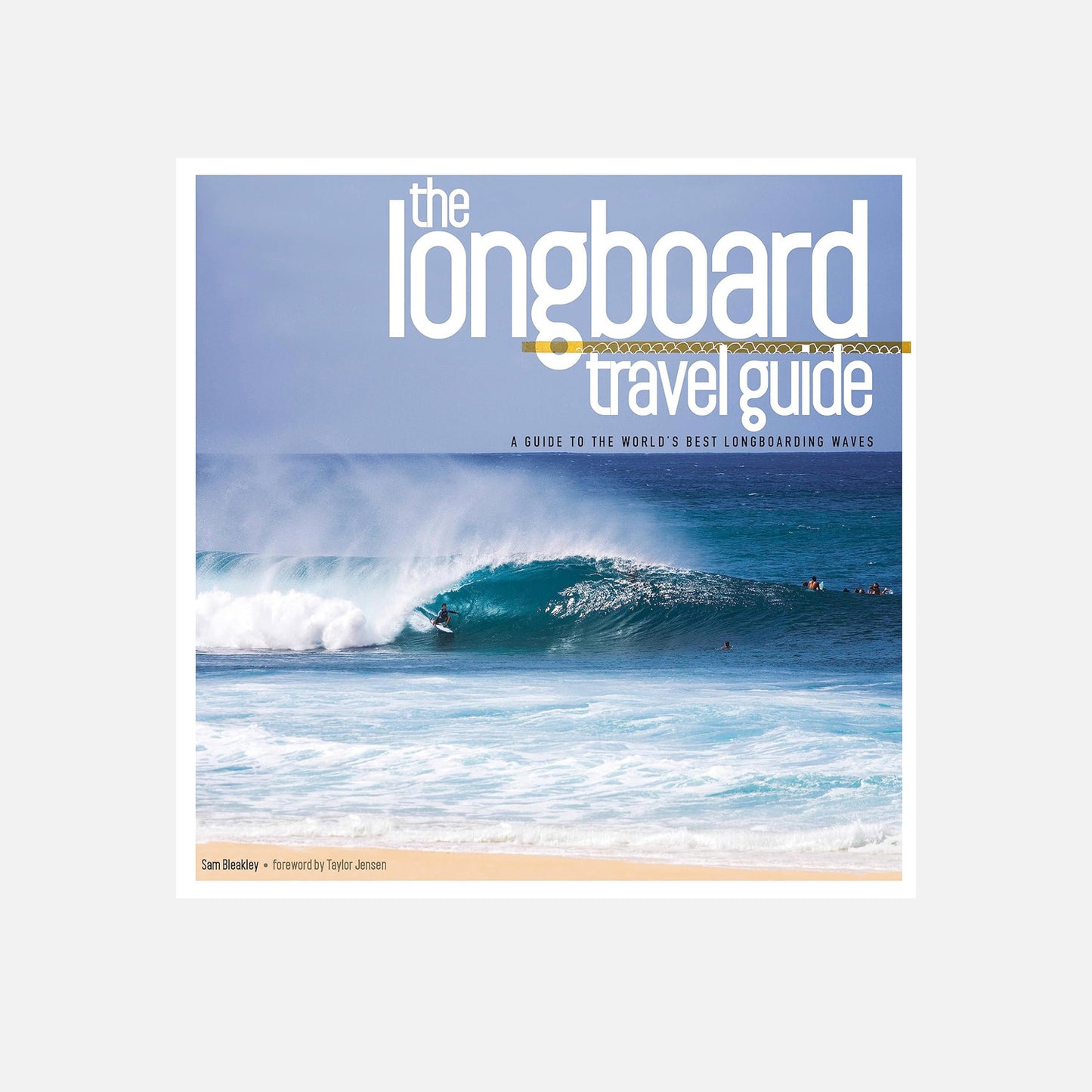 Cover of "The Longboard Travel Guide" featuring a surfer riding a large wave, with text highlighting it as a guide to the world's best longboarding waves.