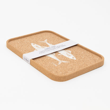 Rectangular cork drinks tray with a lip featuring an illustration of two mackerel in white. The tray is in its packaging.