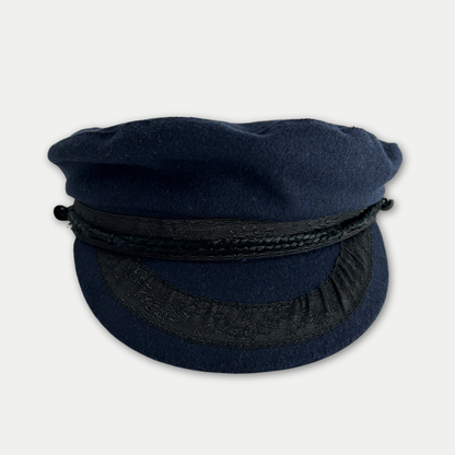 Navy blue cap with a black band on a light gray background