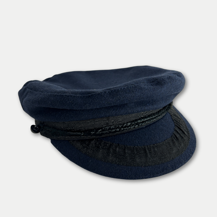 Navy blue hat with braided band on a light gray background