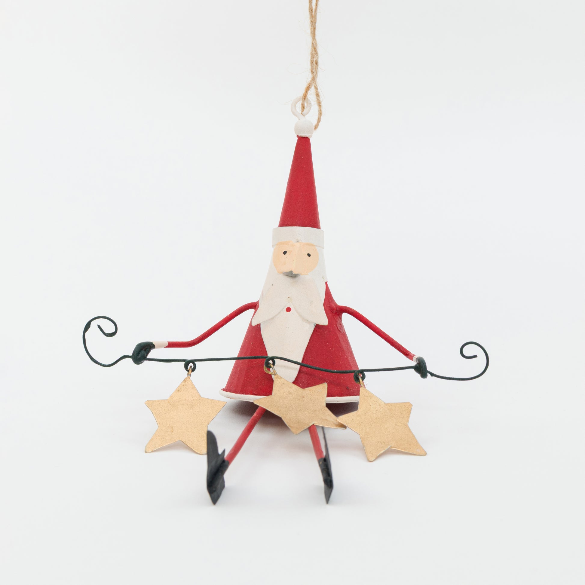 Santa Claus ornament holding a string of lights with stars on a white background