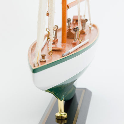 Model sailboat on a white background