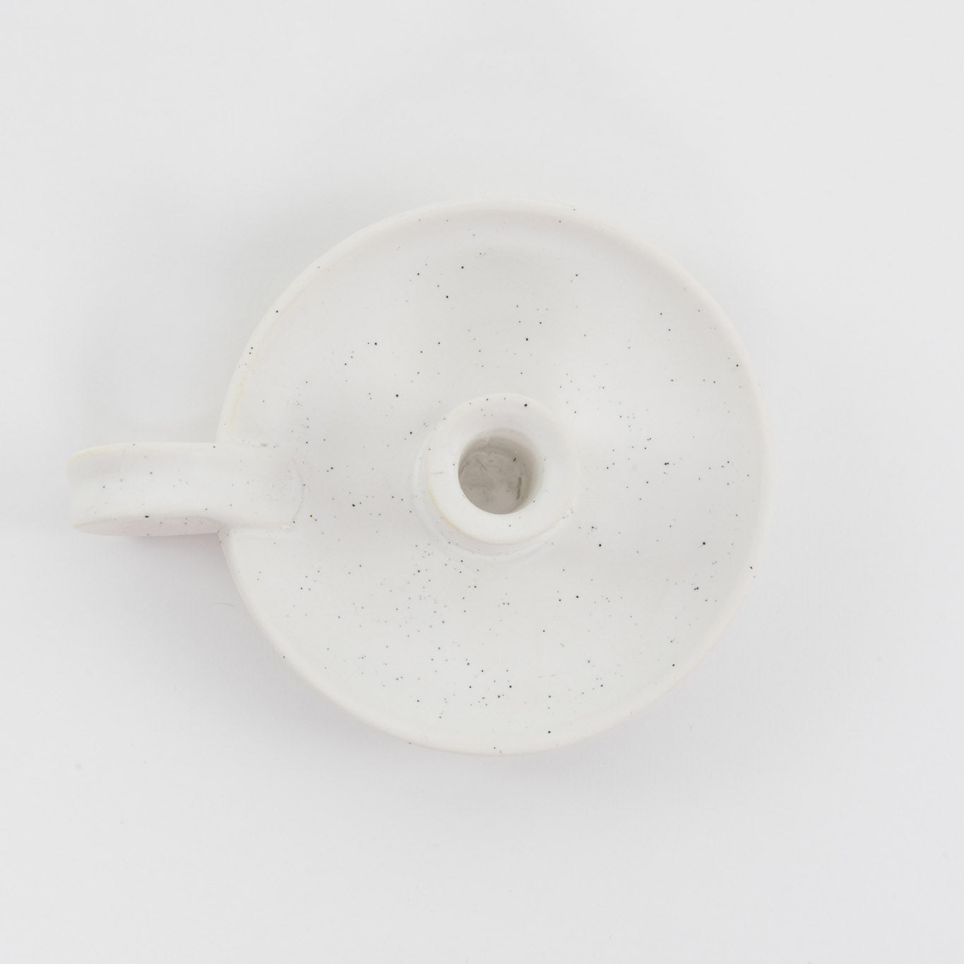 White with cream speckles, ceramic candle holder, shot from above.