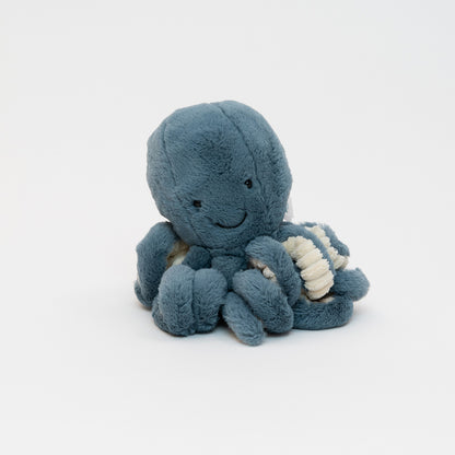 A blue Jellycat plush octopus pictured on a white background.