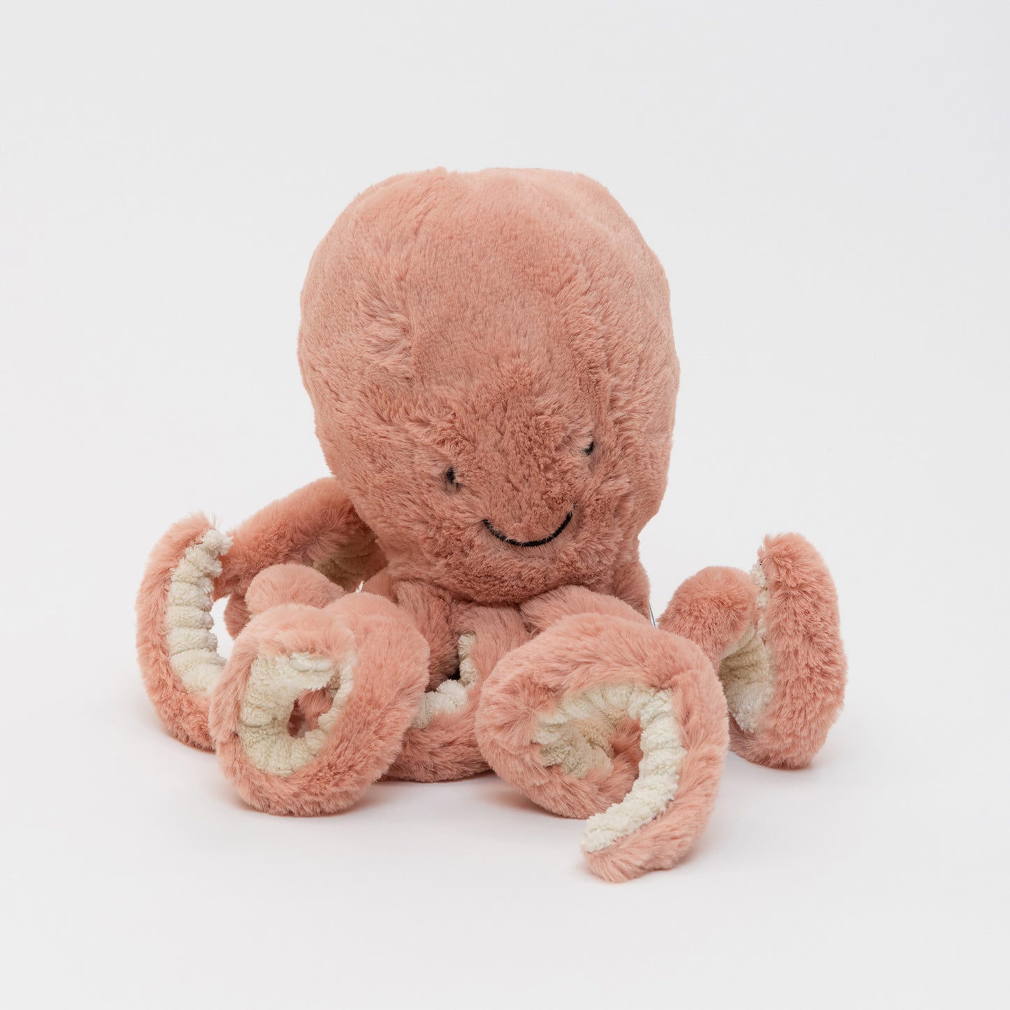 A pink Jellycat plush octopus soft toy on a white background.