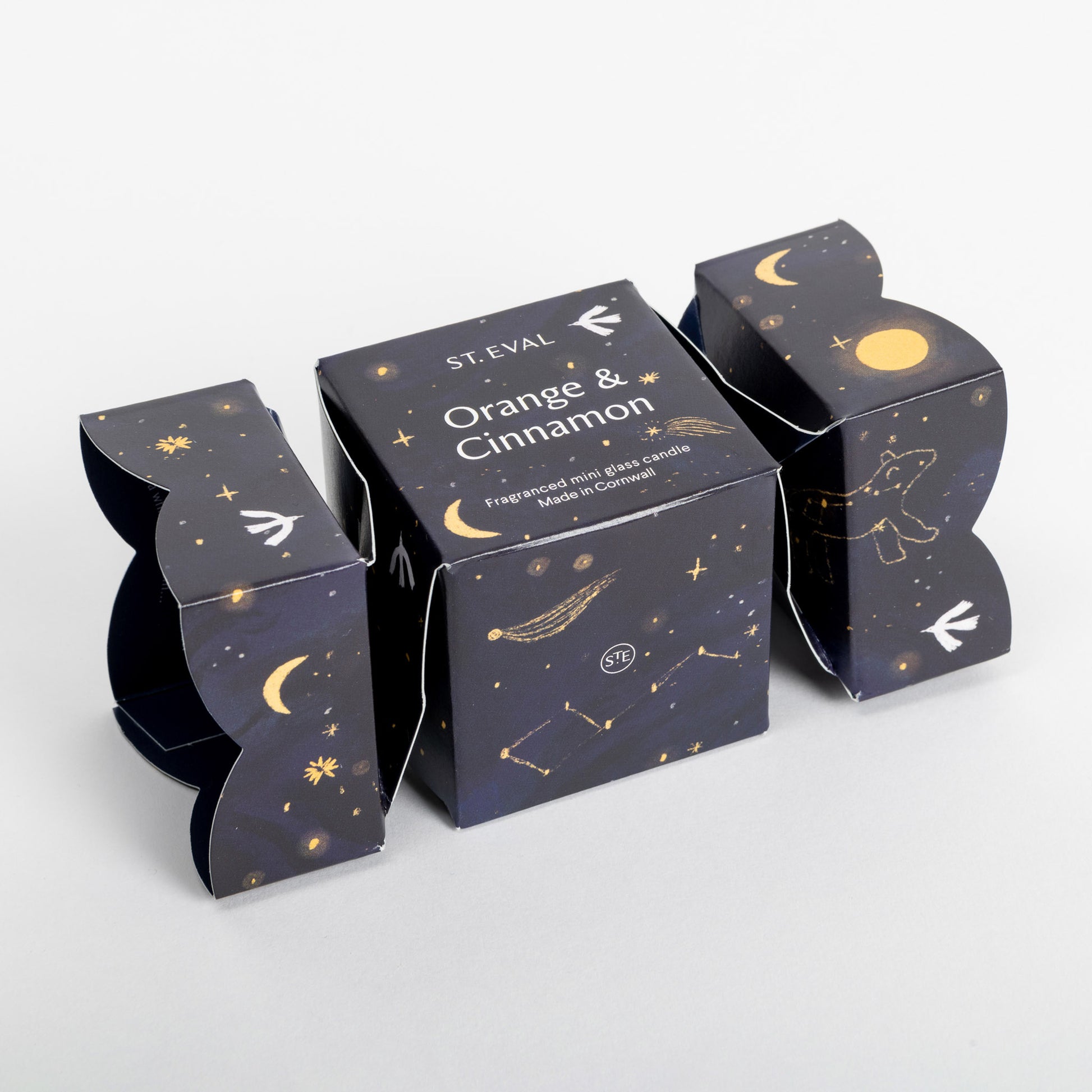 dark blue box in the shape of a cracker, with stars and moons