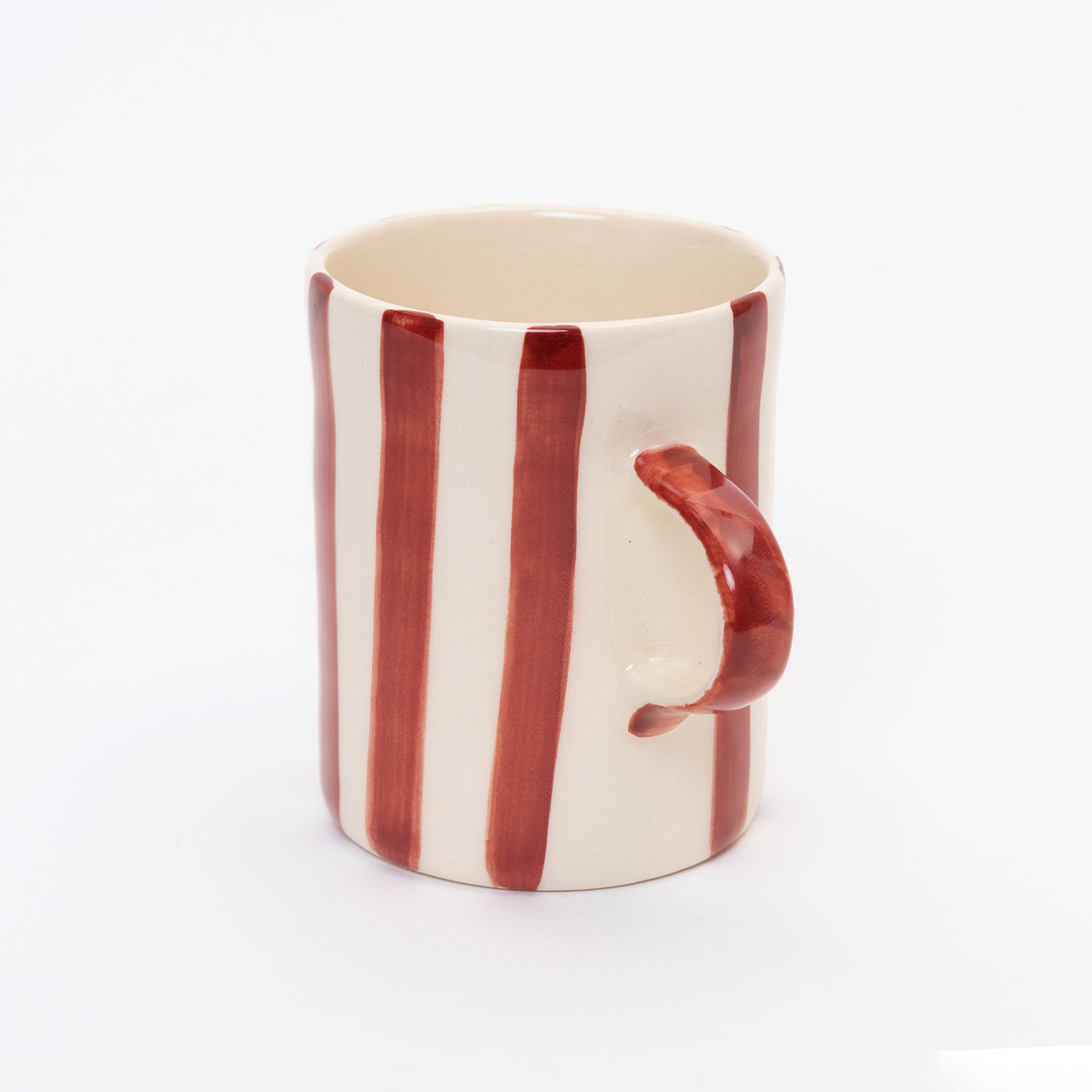 Side shot of Red and white striped mug with red handle