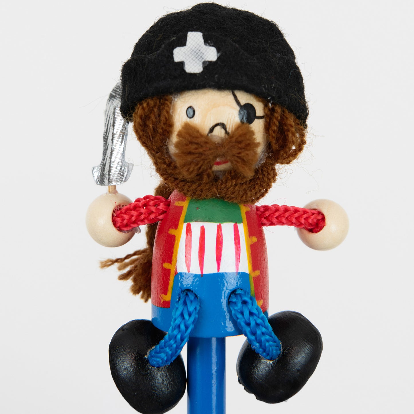 Close up of Pirate on top of a blue pencil. Fun wood and fabric pirate to top of your blue pencil. Pirate complete with black crossbone hat, long brown string hair & mustache, red vest and blue dangly legs with black wood shoes.