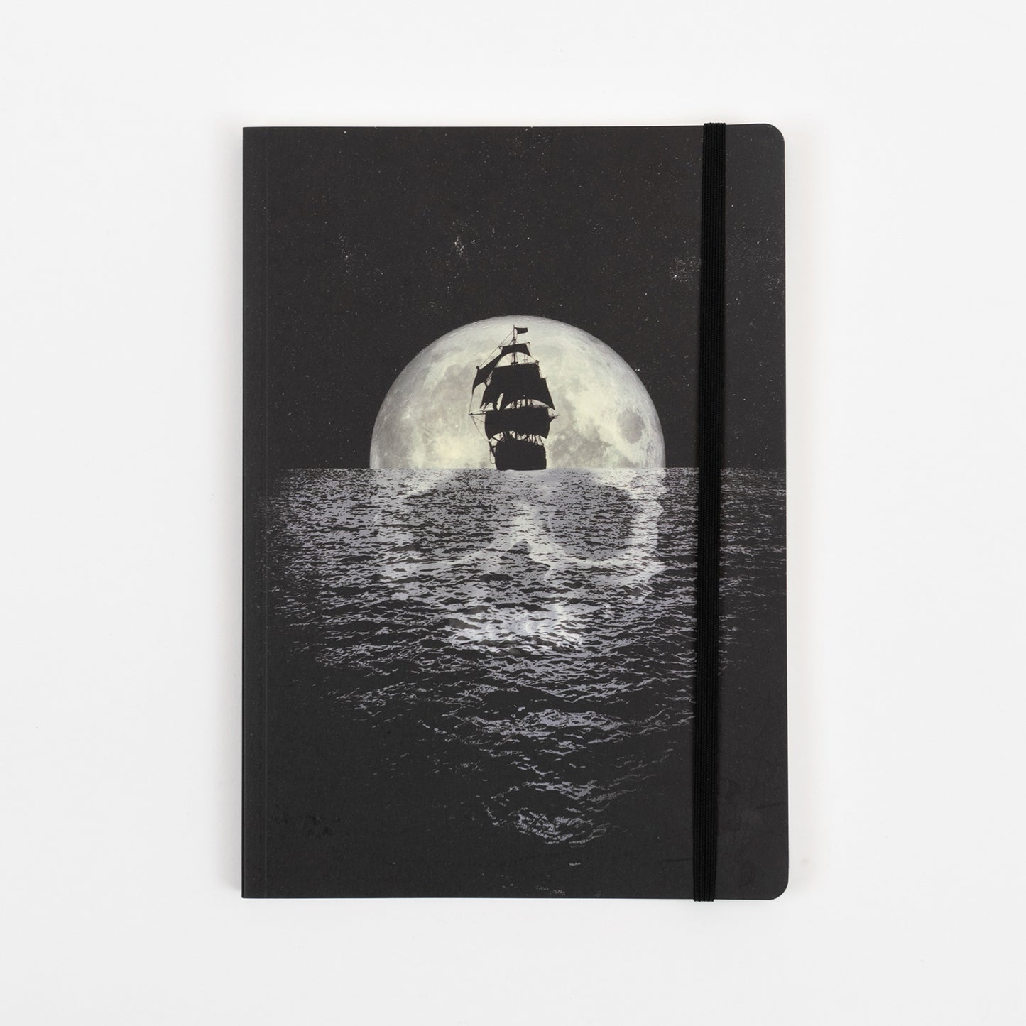 The black cover of the pirates journal with a illustration of a sailing ship in front of a moon and a skull reflection in the sea.