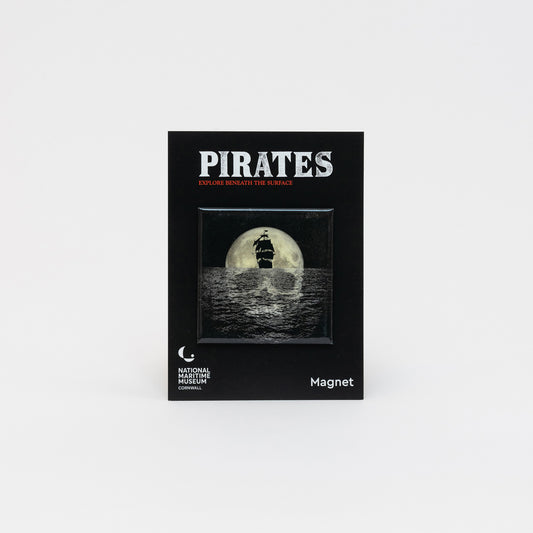 A photo of the National Maritime Museum Cornwall Pirates Exhibition Magnet on a white background. The magnet features a graphic of a skull-shaped moon reflecting on the ocean, behind the black shape of a ship.