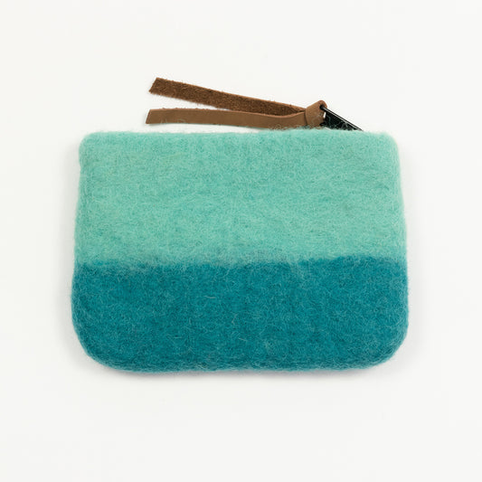 A green felt purse with brown leather zip pull pictured on a white background.