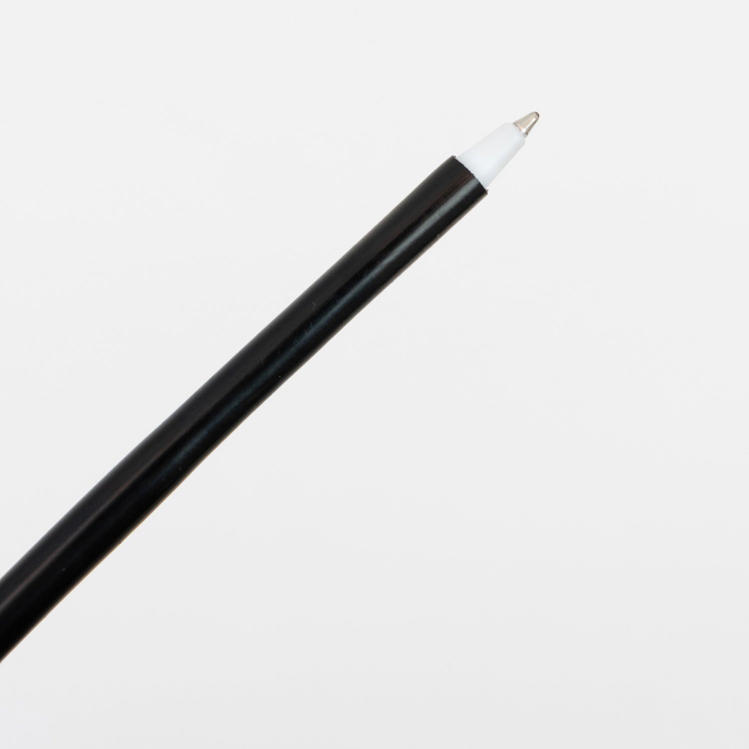 A black quill pen pictured on a white background.