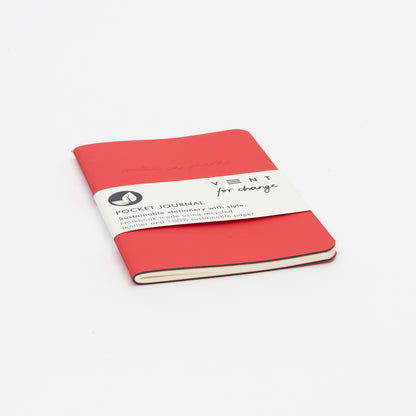 journal with red leather cover and paper packaging