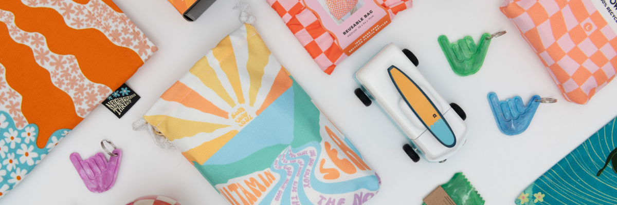 Colorful surf accessories on a white surface