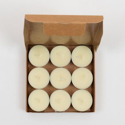 St Eval Sea Salt Tea Lights box of 9 candles. Plain earthy card box open to show 9 circle cream tealights.