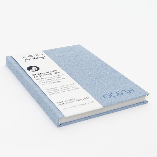 SEa blue notebook lying flat showing belly band packaging