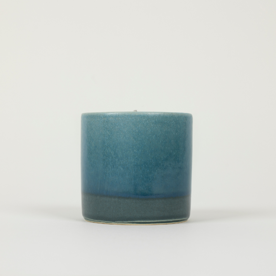 Blue ceramic candle holder on a white background