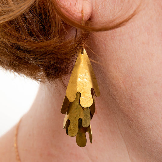 close up of brass cascade design earrings