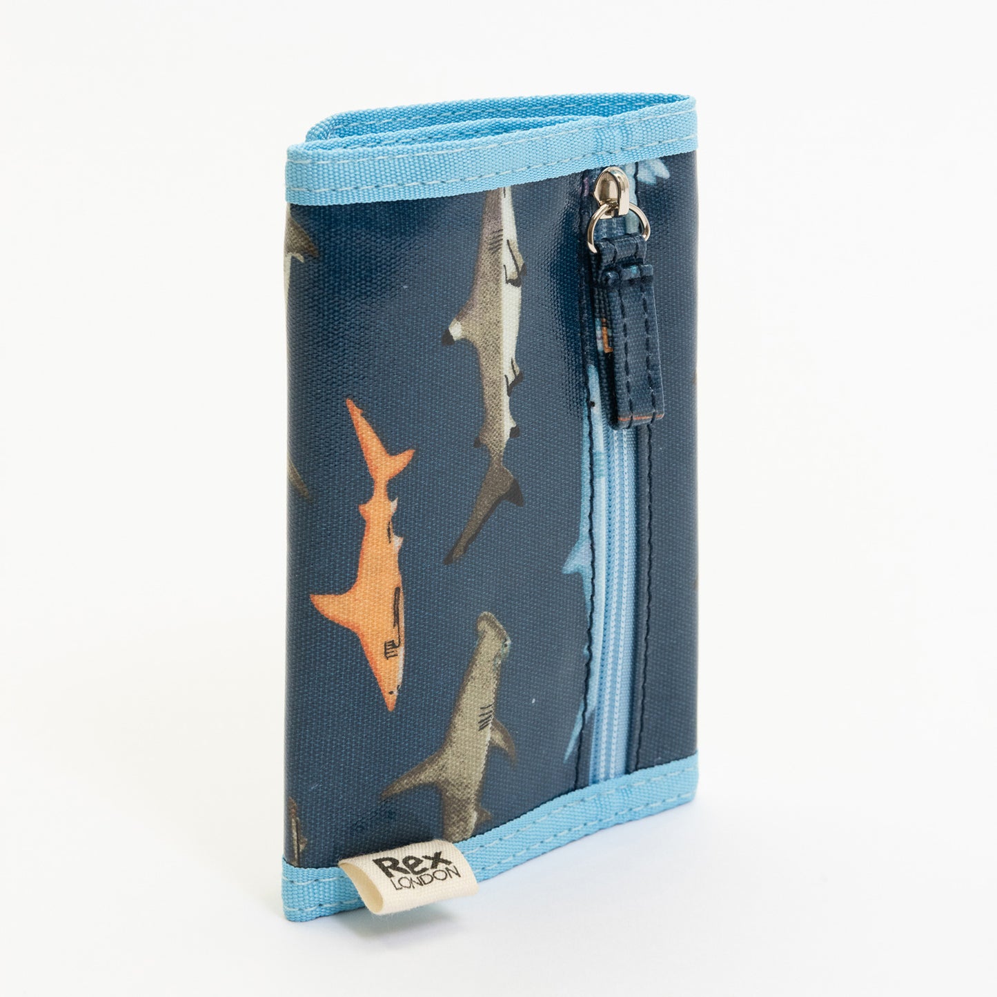 A blue children's wallet with shark illustrations on it. Pictured on a white background.