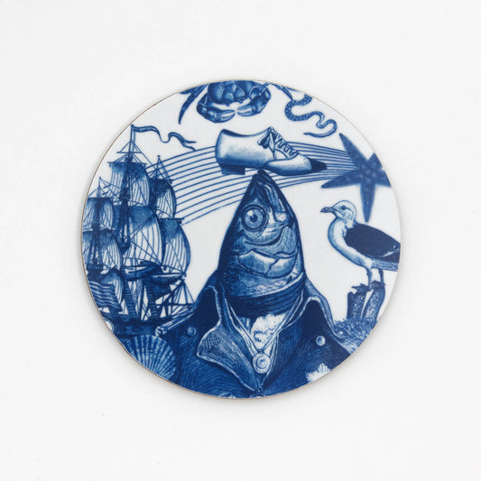 round white coaster with blue illustration of a fish balancing a shoe on its head