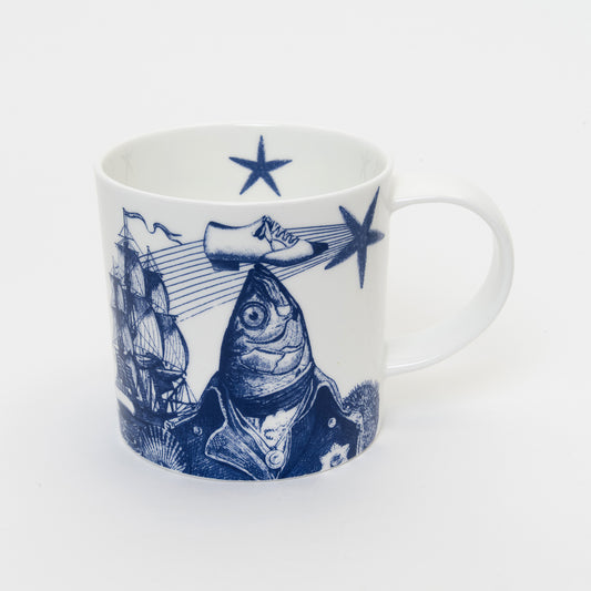 White mug with blue illustration of fish balancing shoe on its head