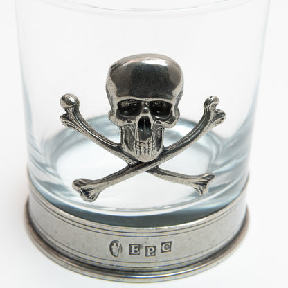 A close-up photo of the pewter skull and cross bones on the tumbler.