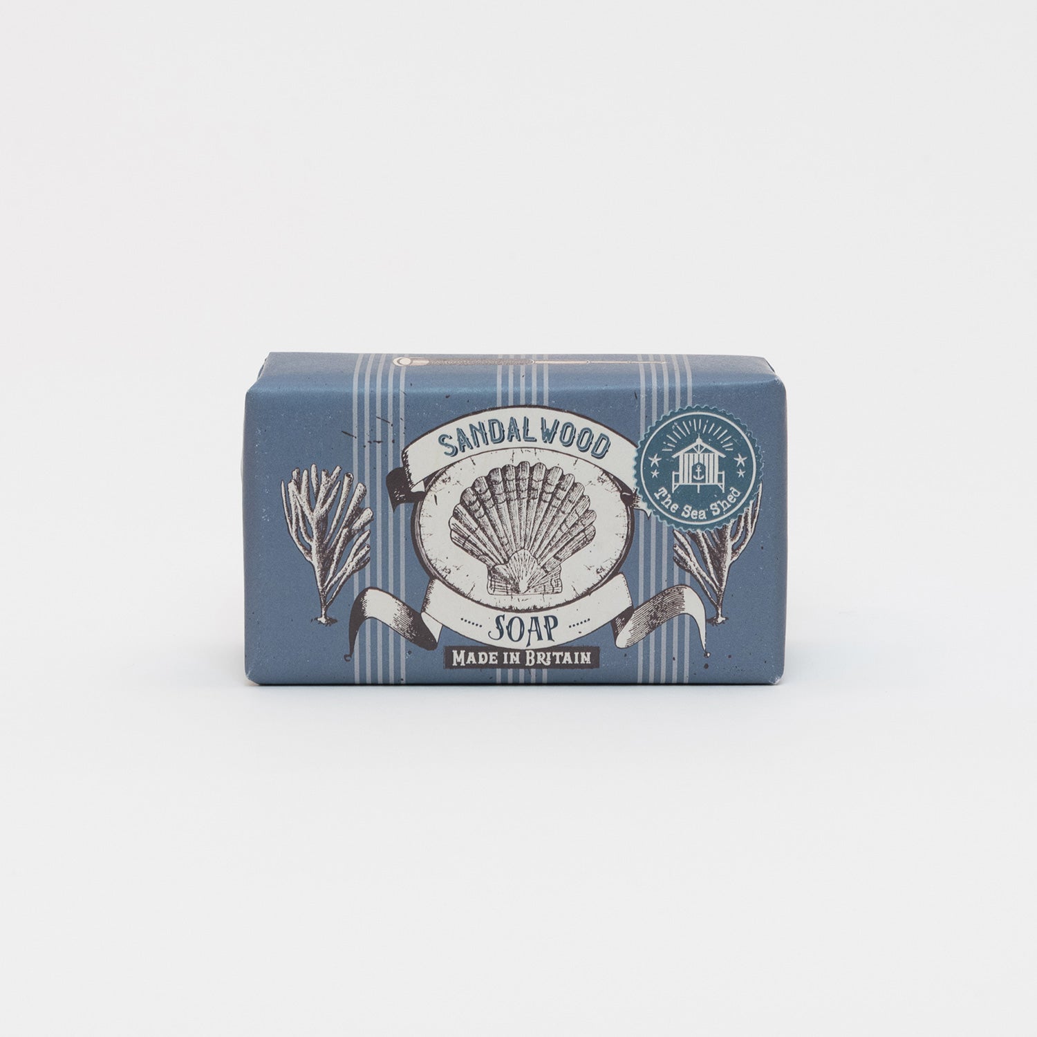 Packaged Cornish Sandalwood Soap on a white background. The packaging is dark blue with illustrations of a shell and seaweed.