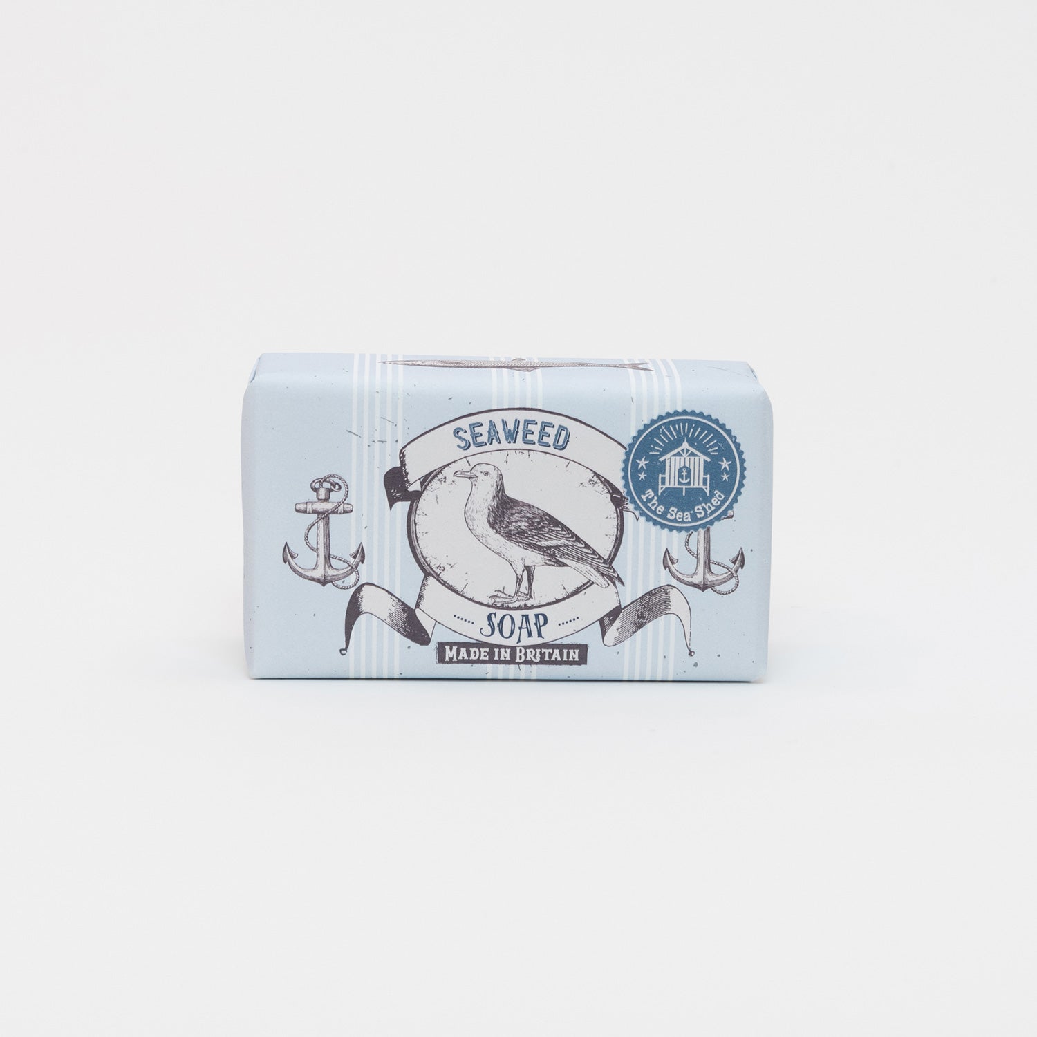 A photo of packaged Cornish Seaweed Soap on a white background. The packaging is blue and white with illustrations of a seagull and anchors.