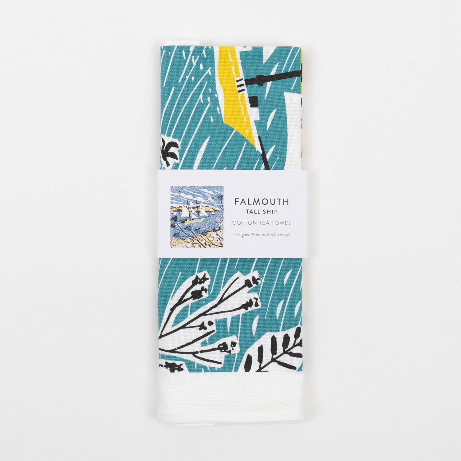 The blue, white and yellow tall ships tea towel in its packaging.