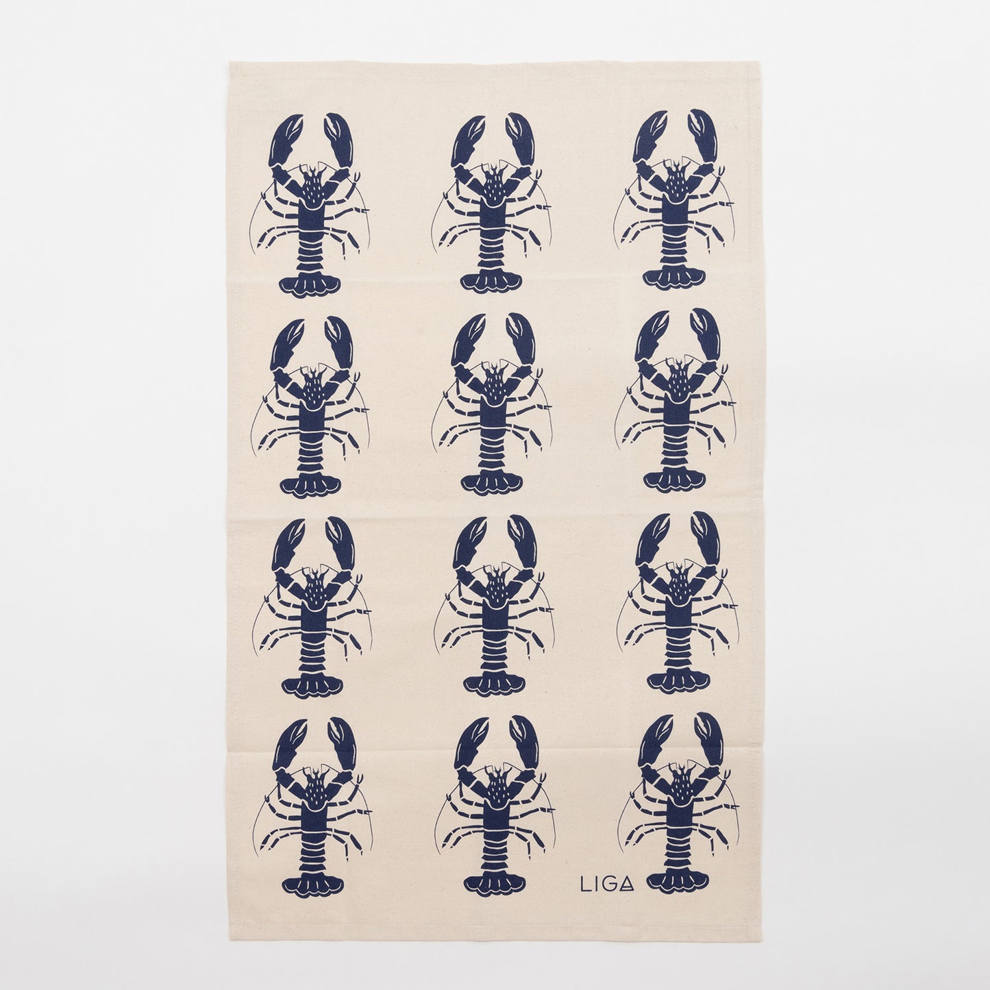 Navy lobster repeated pattern on a cream coloured tea towel. The Navy Lobster Tea Towel is against a white background.