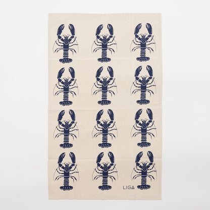 Navy lobster repeated pattern on a cream coloured tea towel. The Navy Lobster Tea Towel is against a white background.