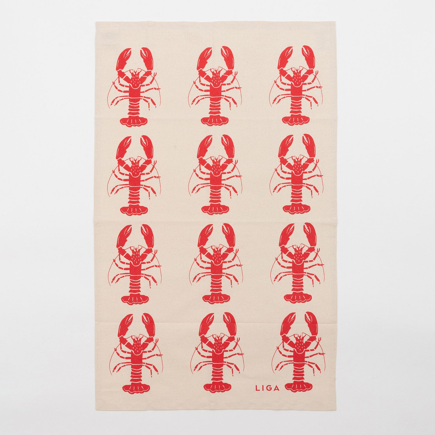 Red lobster repeating pattern on a cream coloured back ground. The Red Lobster Tea Towel in on a white background.