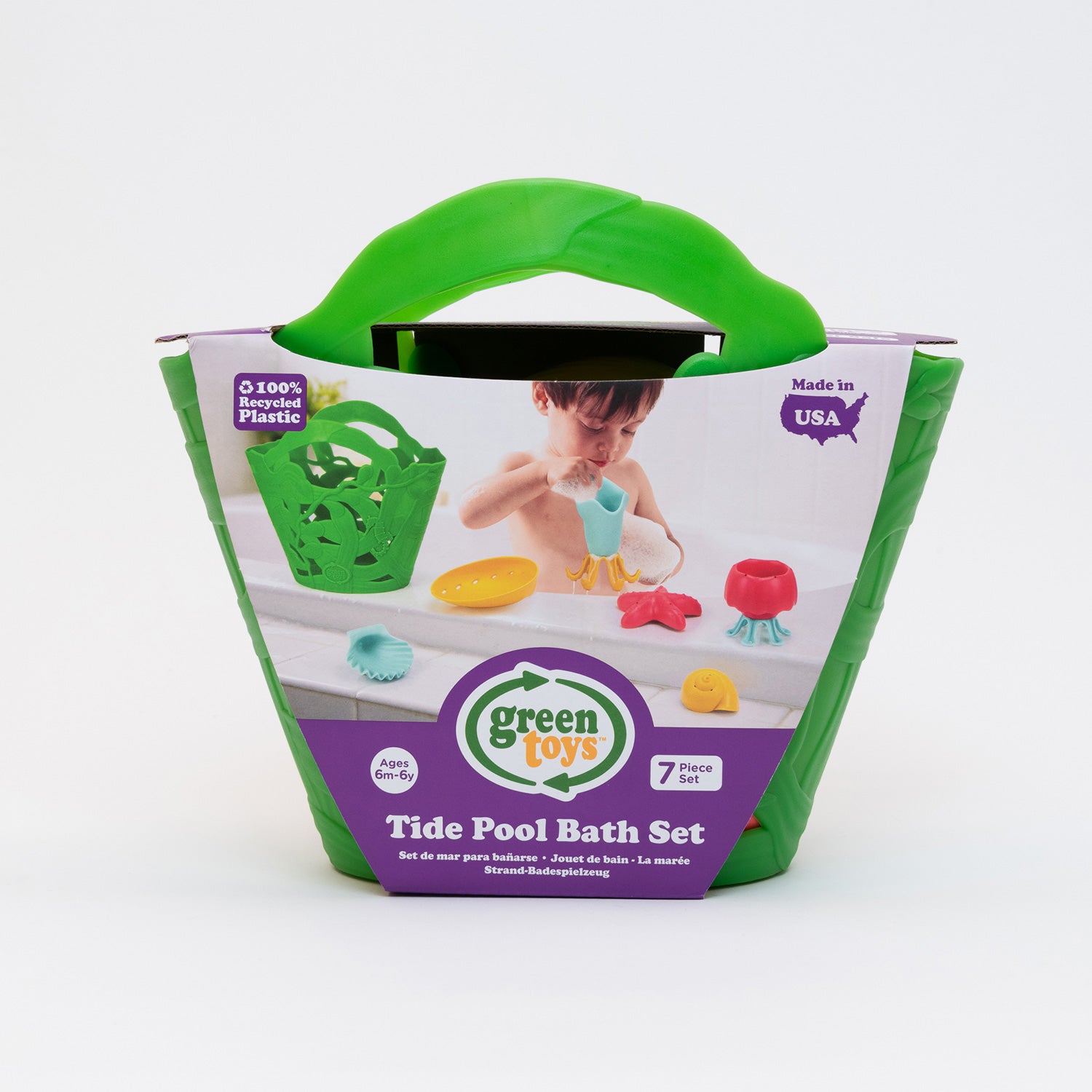 Green Toys Tide Pool Bath Set. Green Plastic seaweed bucket with coloured plastic sealife toys 7 peice set. In cardboard sleeve depicting a small child playing in the bath with these toys.