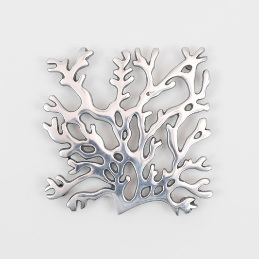 A top down view of the stainless steel silver seaweed shaped trivet.