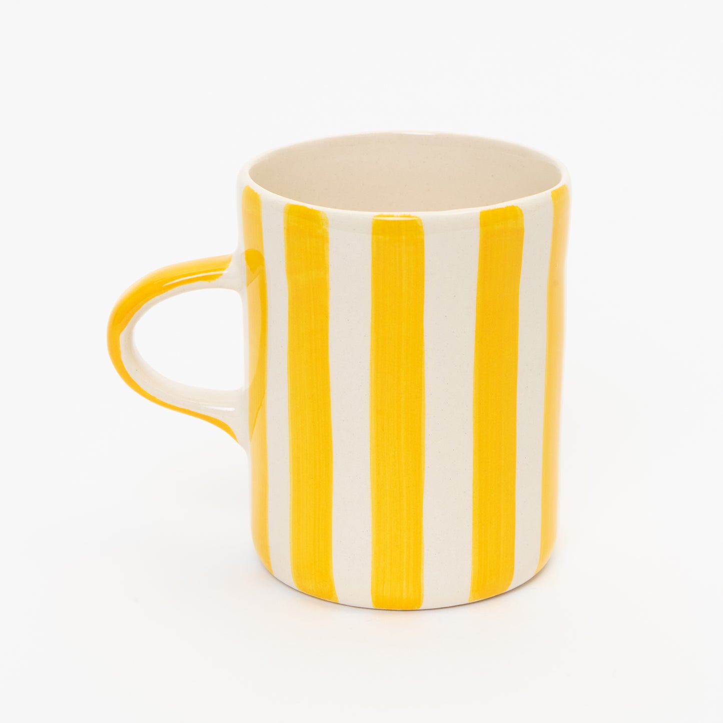 Yellow and white striped mug with yellow handle