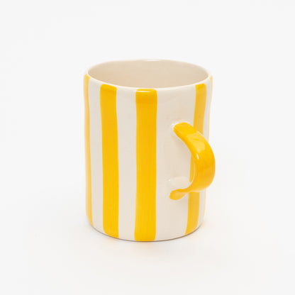 Yellow and white striped mug with yellow handle