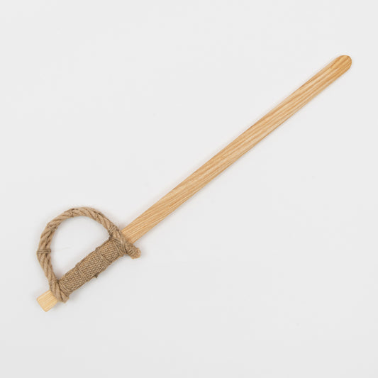 A wooden toy pirate sword pictured on a white background.